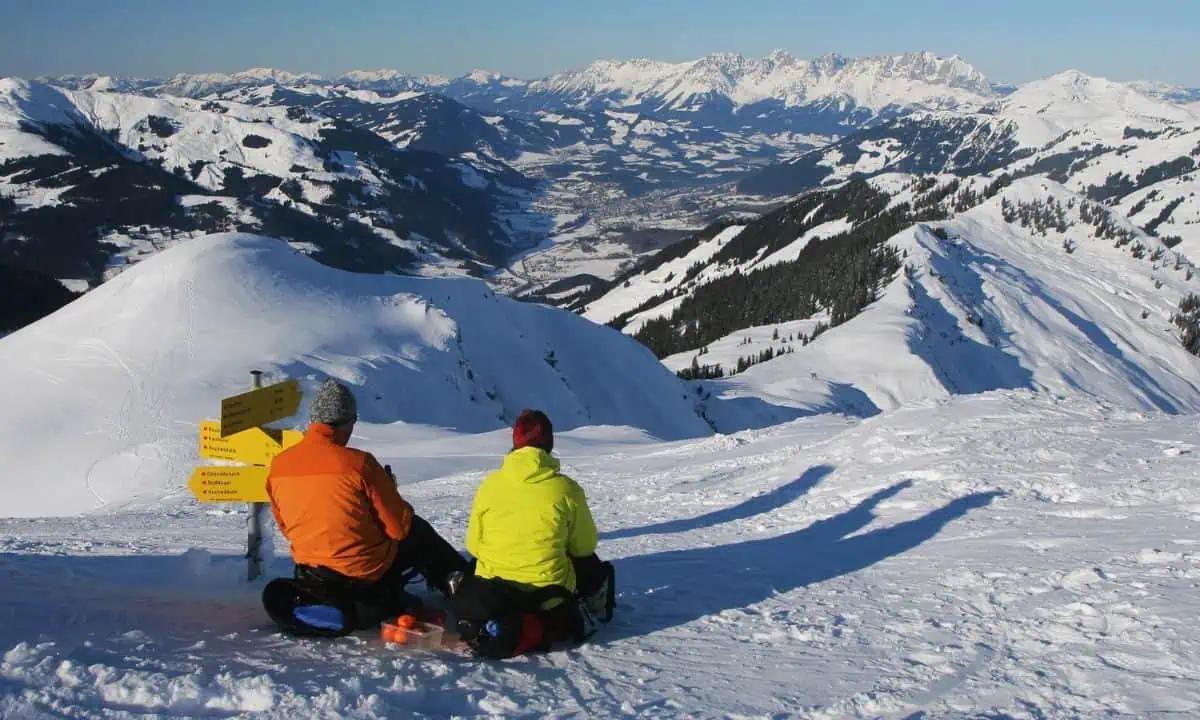 Tourists winter mountain hiking