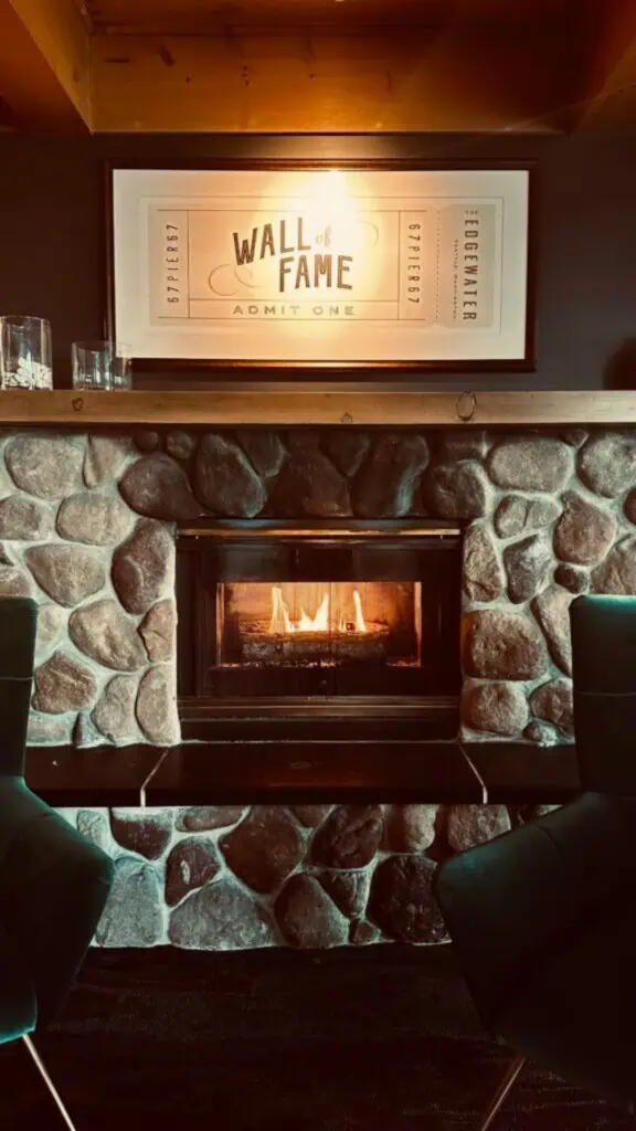 A room with black and white photos on the wall.