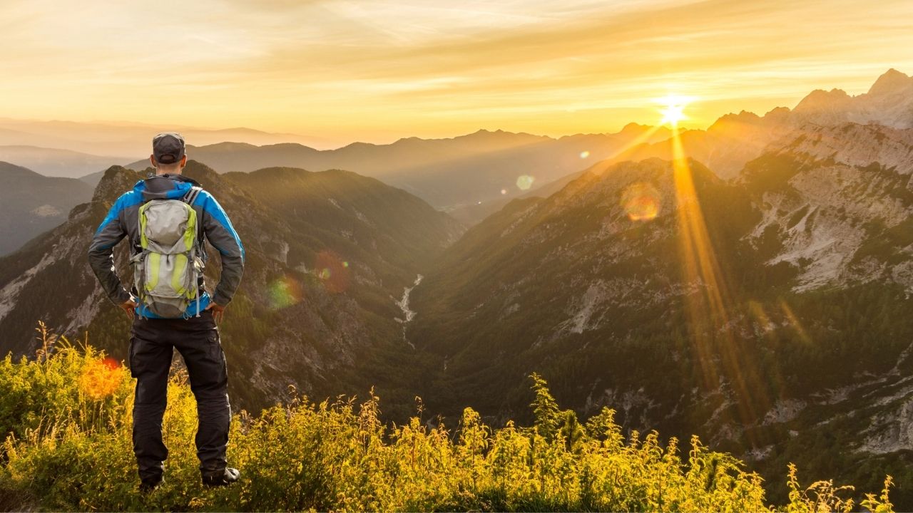 Hiker watching the sun rise